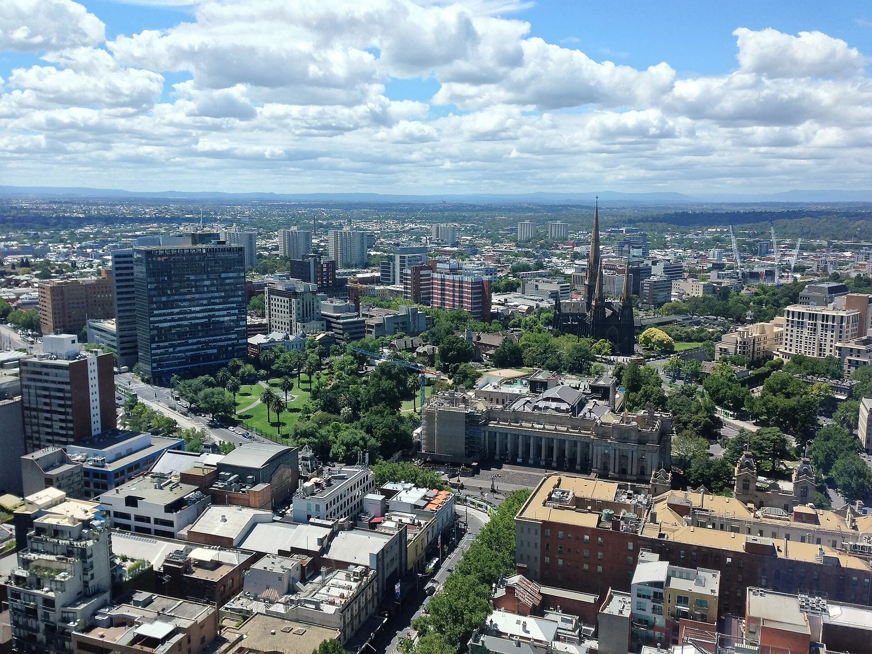 Looking east-north-east with St Patrick's Cathedral, Parliament House and other landmarks visible in the scene.
